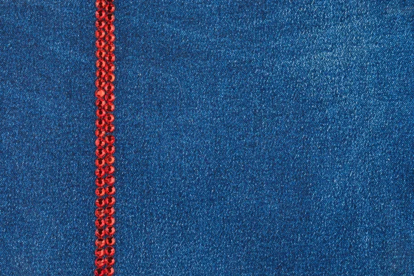 Denim fabric decorated with red rhinestones — Stock Photo, Image
