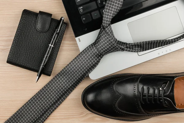 Fashion and business, notebook, shoes and tie on a wooden table as background — Stock Photo, Image