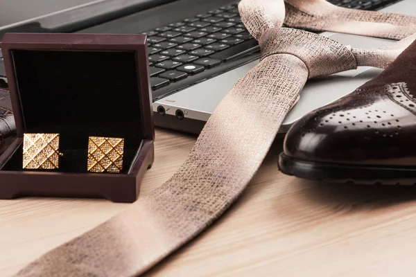 Silk tie lying on a laptop, selective focus — Stock Photo, Image