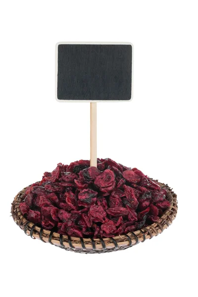 Heap de cranberry seco em uma placa, com um ponteiro para o seu te — Fotografia de Stock