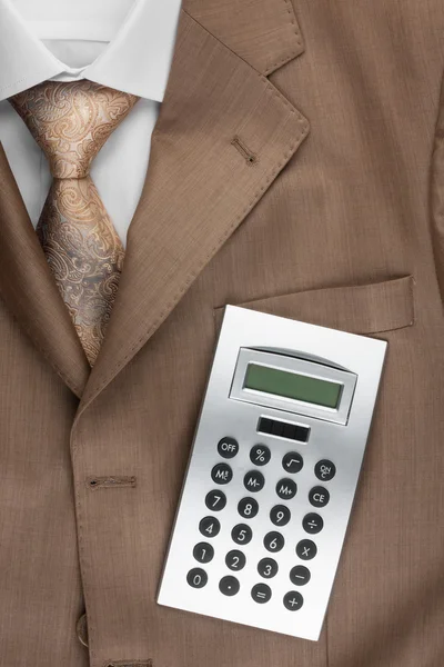 Calculator lies on the suit — Stock Photo, Image