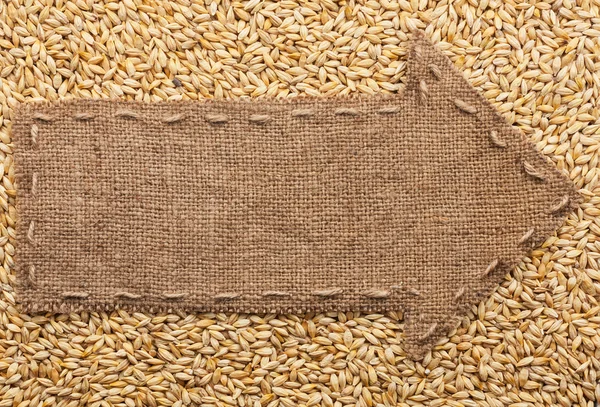 Pointer of burlap with place for your text, lying on a barley — Stock Photo, Image