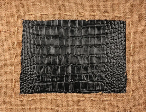 Frame of burlap, lies on a background of leather — Stock Photo, Image