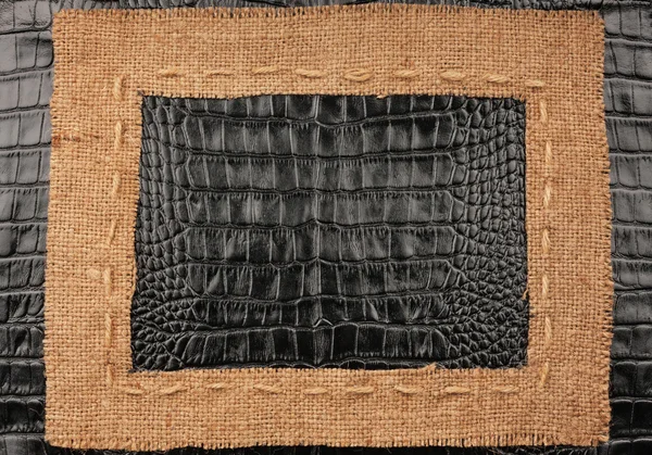 Frame of burlap, lies on a background of leather — Stock Photo, Image