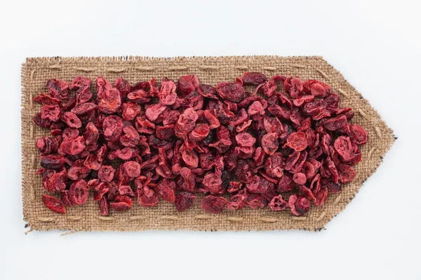 Pointer of  burlap with dried  cranberry — Stock Photo, Image