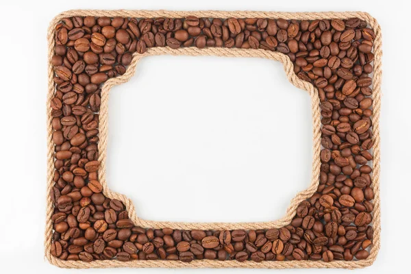 Dois quadros da corda com grãos de café em um fundo branco — Fotografia de Stock