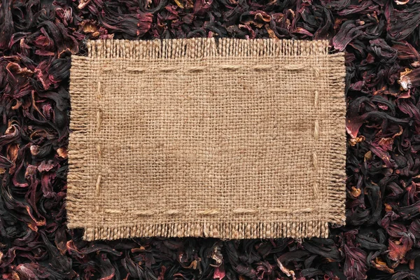 Frame made of burlap with the line lies on  hibiscus — Stock Photo, Image