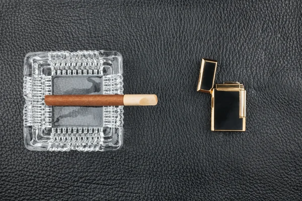 Lighter and glass ashtray with cigar — Stock Photo, Image