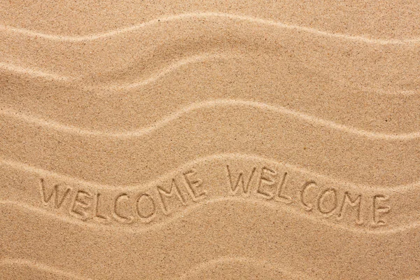 Welcome inscription on the wavy sand — Stock Photo, Image