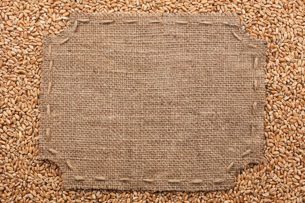 Figured frame with burlap and stitches with  place for your text — Stock Photo, Image