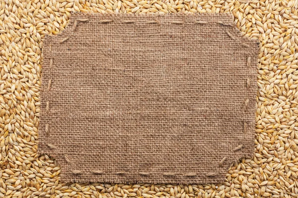 Figured frame with burlap and stitches with  place for your text — Stock Photo, Image