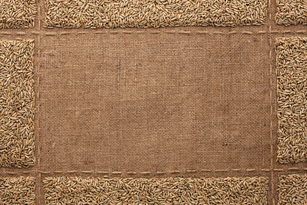 Beautiful frame with rye  on sackcloth — Stock Photo, Image