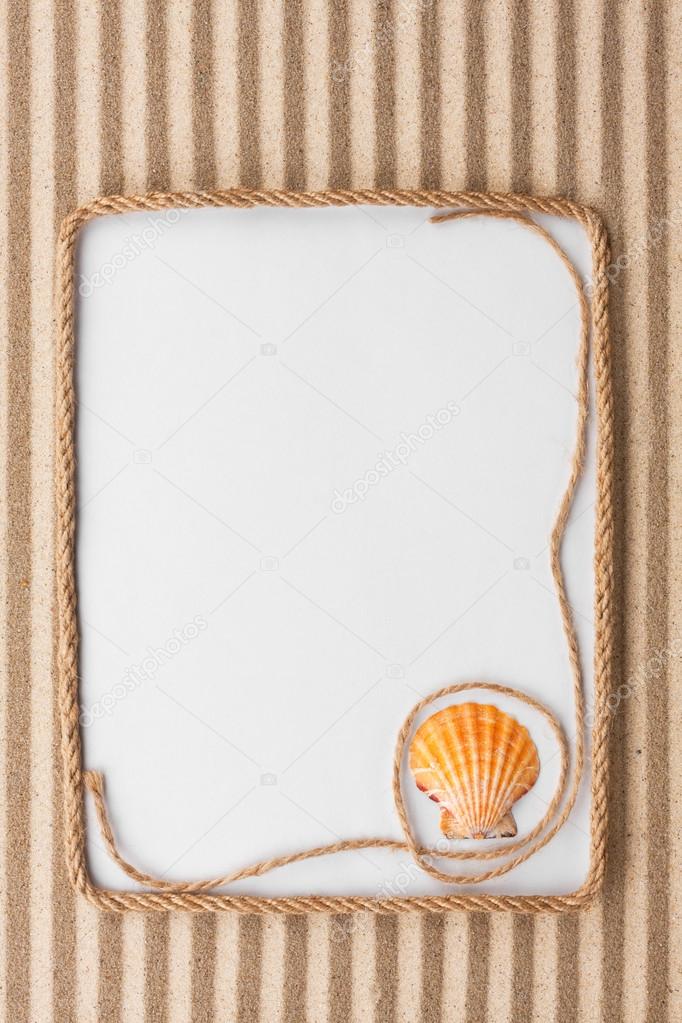 Beautiful frame of rope and sea shells with a white background o