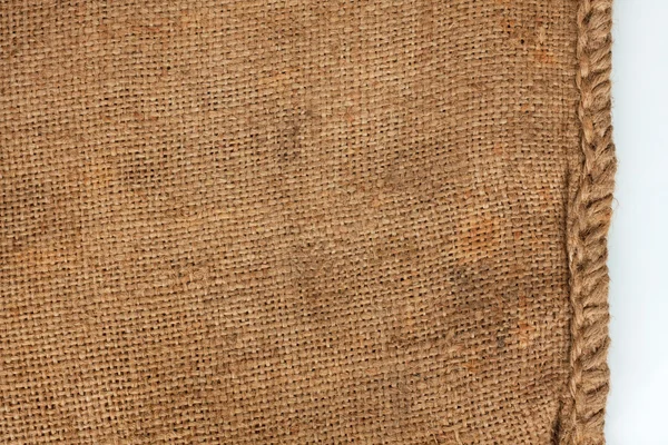 Costura áspera em uma velha serapilheira — Fotografia de Stock