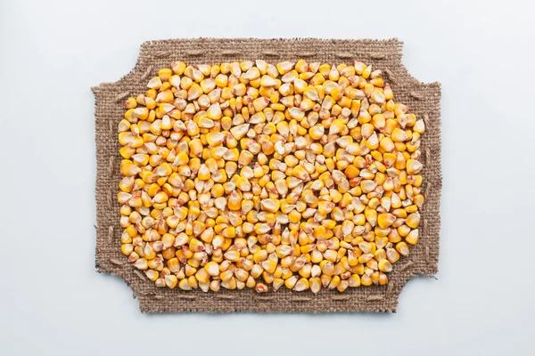Figurowe rama wykonana jest z ziaren płótnie i kukurydzy — Zdjęcie stockowe