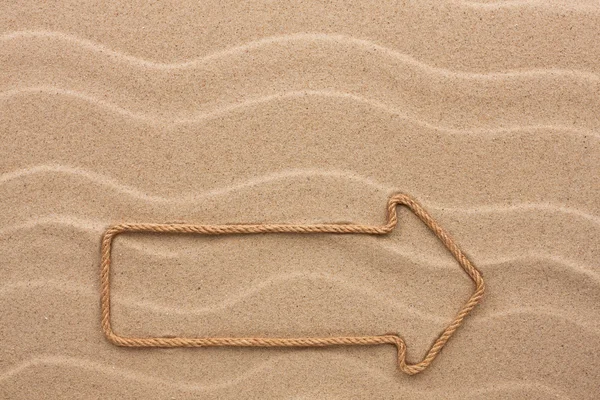 Pointer made of rope on the sand — Stock Photo, Image