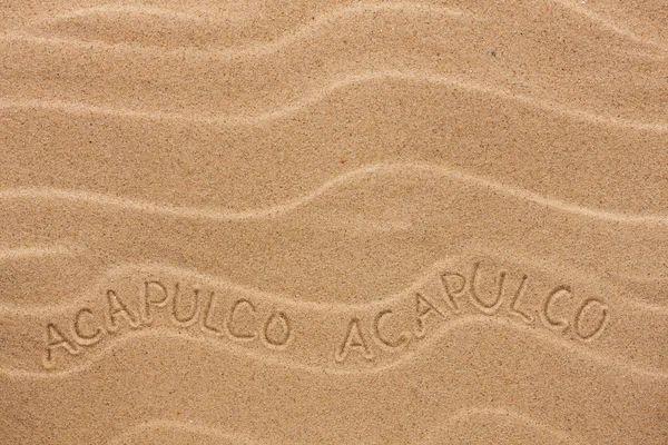 Acapulco  inscription on the wavy sand — Stock Photo, Image
