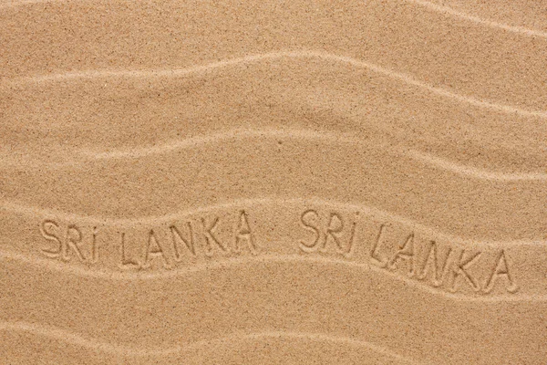 Sri Lanka inscription on the wavy sand — Stock Photo, Image