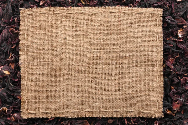 Frame made of burlap with the line lies on  hibiscus — Stock Photo, Image