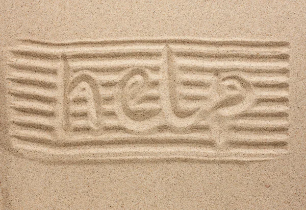 Word help written in the sand — Stock Photo, Image