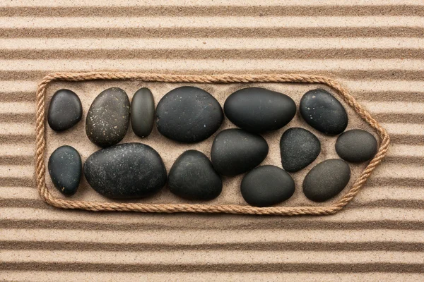 Puntero hecho de cuerda con piedras negras —  Fotos de Stock