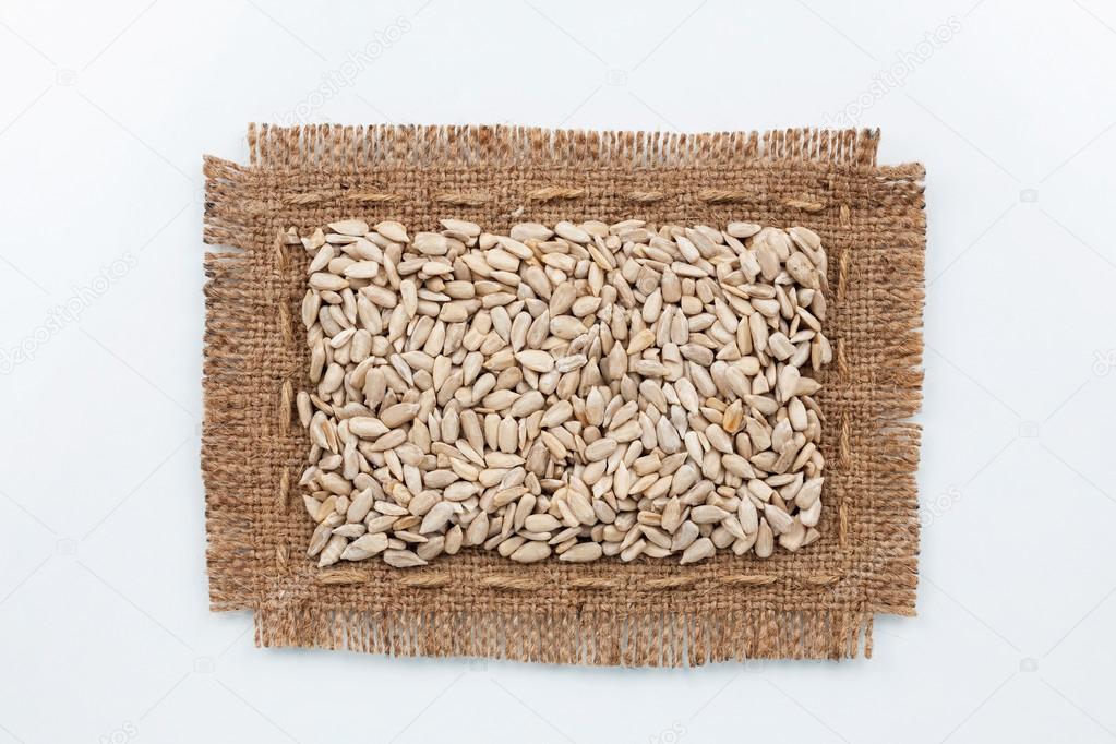 Classical frame made of burlap with seeds of sunflower