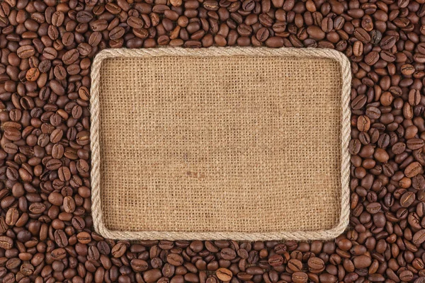 Frame  made of rope with  coffee beans  lying on sacking — Stock Photo, Image