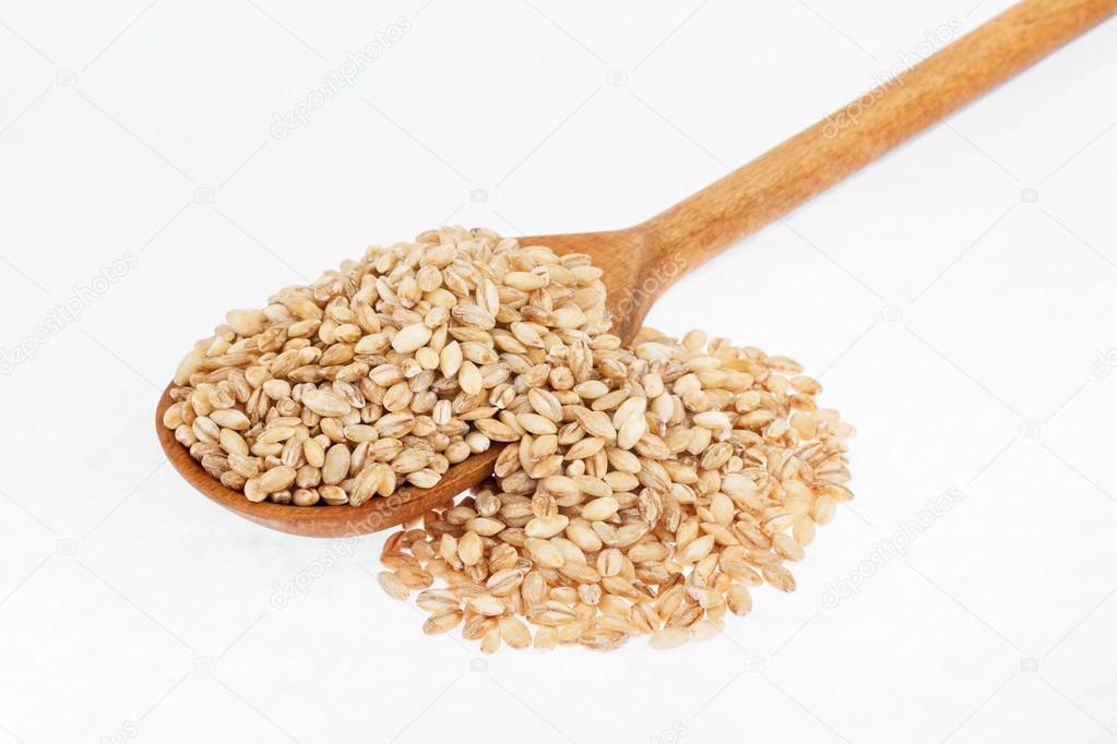 Wooden spoon with pearl barley