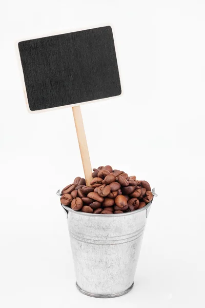 Pointeur, prix en seau de grains de café — Photo
