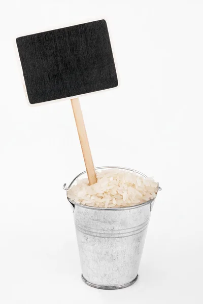 Pointer, price in bucket of  rice grains — Stock Photo, Image