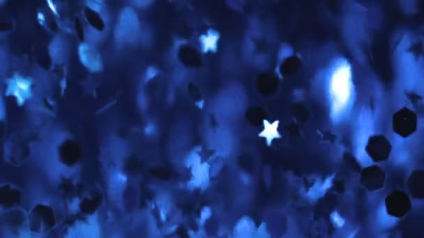 Defocused particle motion in the blue water — Stock Video