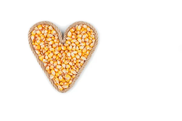 Symbolic heart made from rope with corn grains — Stock Photo, Image