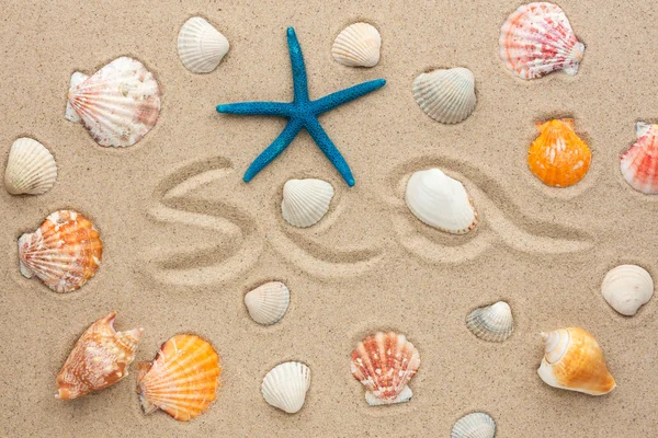 The word sea written on the sand — Stock Photo, Image