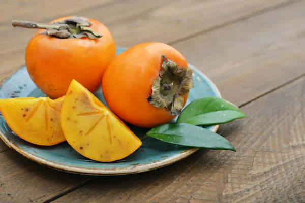 Ripe sweet persimmons — Stock Photo, Image