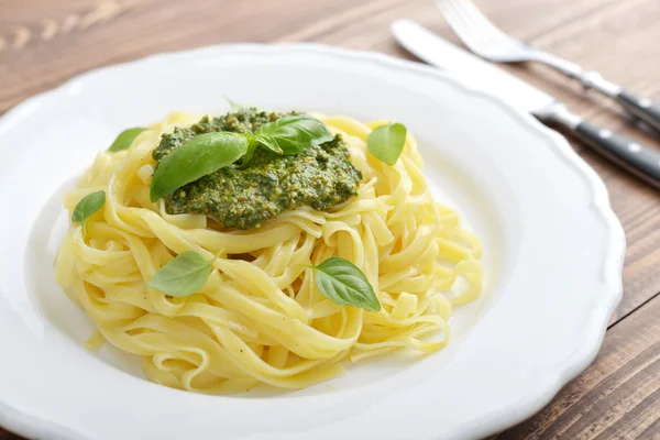 Tagliatelle pasta with pesto sauce — Stock Photo, Image