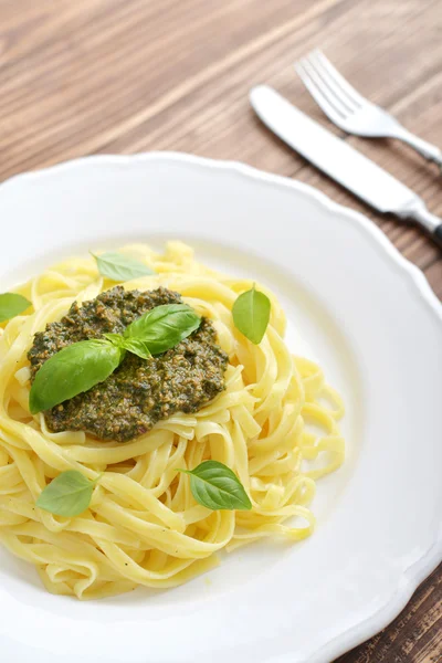 Tagliatelle pasta with pesto sauce — Stock Photo, Image