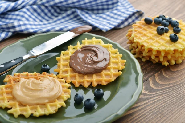 Belgian waffles with chocolate cream and peanut butter — Stock Photo, Image