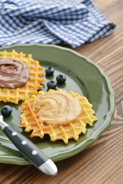 Belgian waffles with chocolate cream and peanut butter — Stock Photo, Image