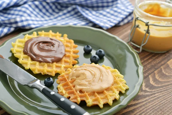 Belgian waffles with chocolate cream and peanut butter — Stock Photo, Image