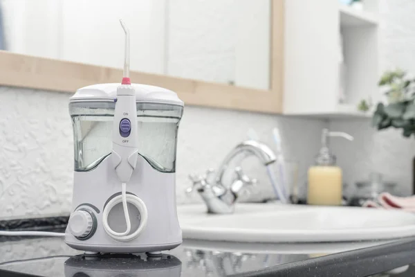 Electric Oral Irrigator White Tiled Bathroom Closeup — Stock Photo, Image