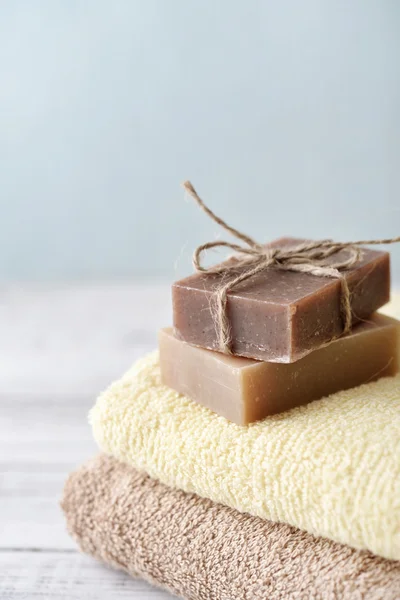 Towels with soap bars — Stock Photo, Image