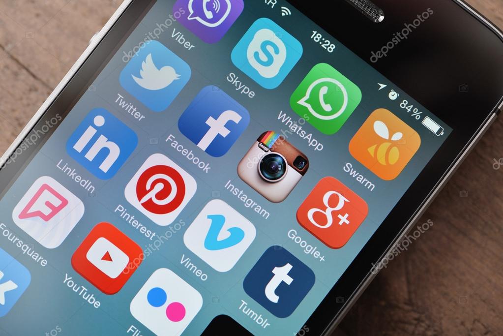 KIEV, UKRAINE - JANUARY 29, 2015: Most popular social media icons on screen of smartphone close up. Social media are most popular tool for communication, sharing information and content between people in internet network.