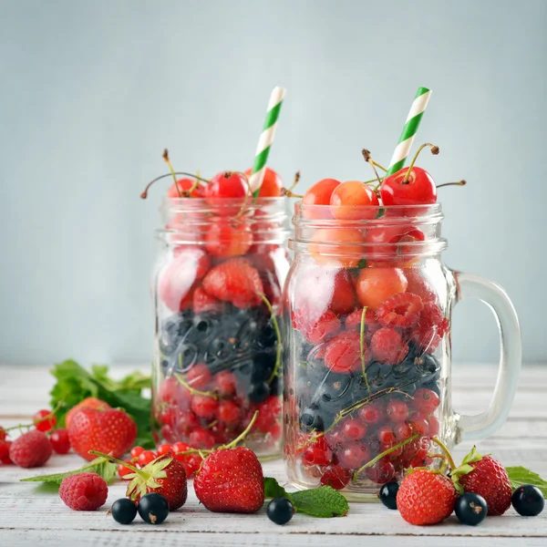 Berries in  jar with handle — Stock Photo, Image