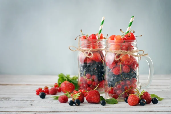 Berries in  jar with handle — Stock Photo, Image