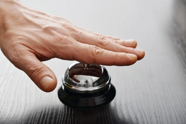 Hand ringing in service bell — Stock Photo, Image