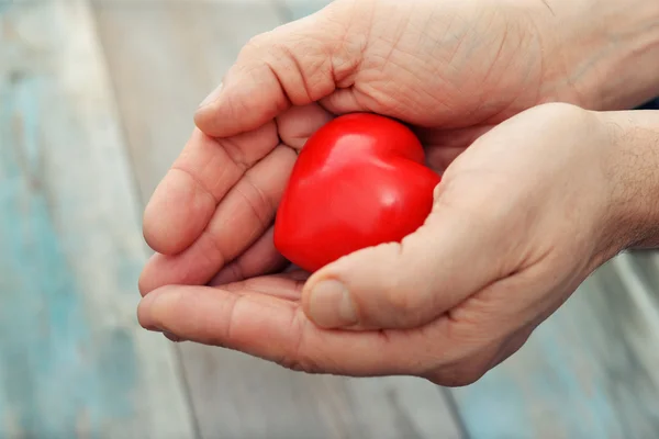 Hands with stone heart — Stock Photo, Image