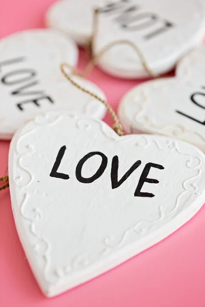 Love Wooden white heart on pink background — Stock Photo, Image