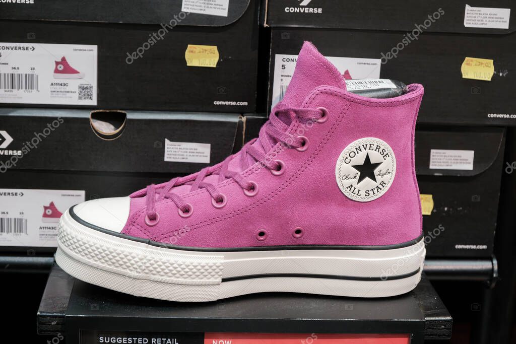 Penang, Malaysia - October 16, 2025 A luxury handbag featuring a golden horse and carriage logo is prominently displayed. The bag is crafted from high-quality leather and showcases elegance.