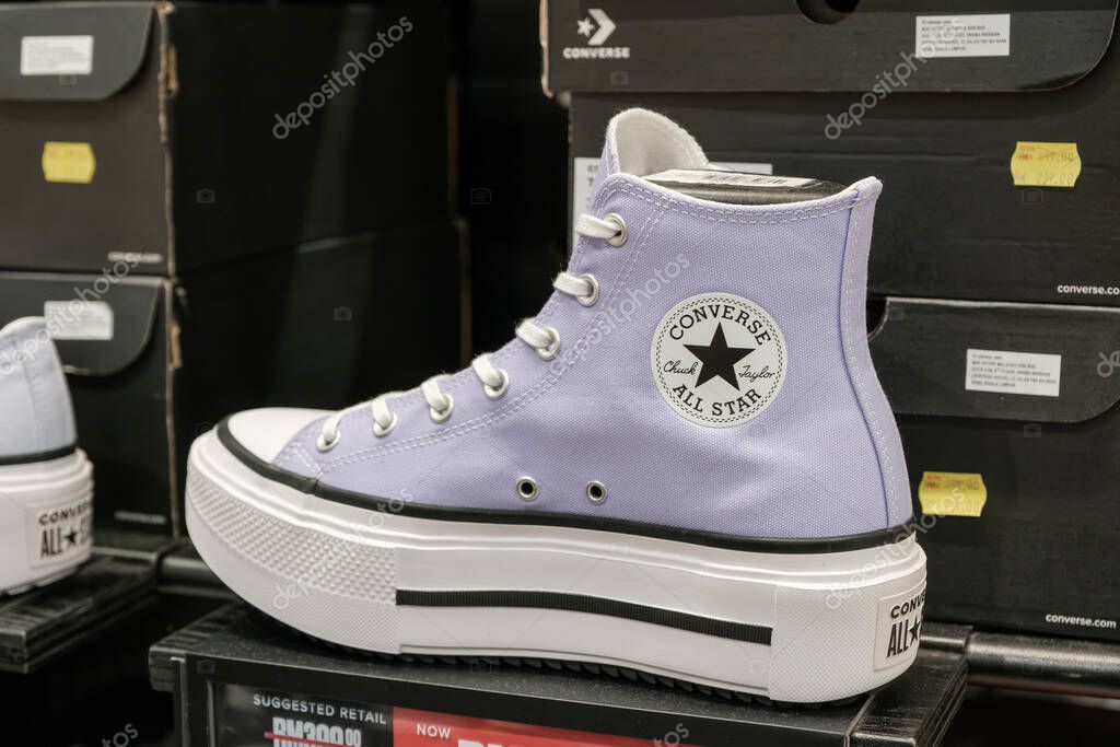 Penang, Malaysia - October 16, 2025 A luxury handbag featuring a golden horse and carriage logo is prominently displayed. The bag is crafted from high-quality leather and showcases elegance.