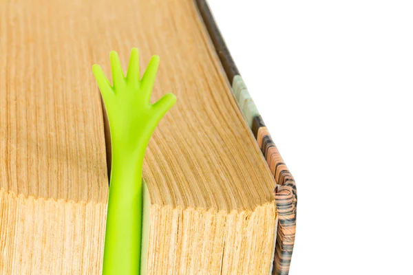 Book with plastic hand bookmark isolated on white — Stock Photo, Image